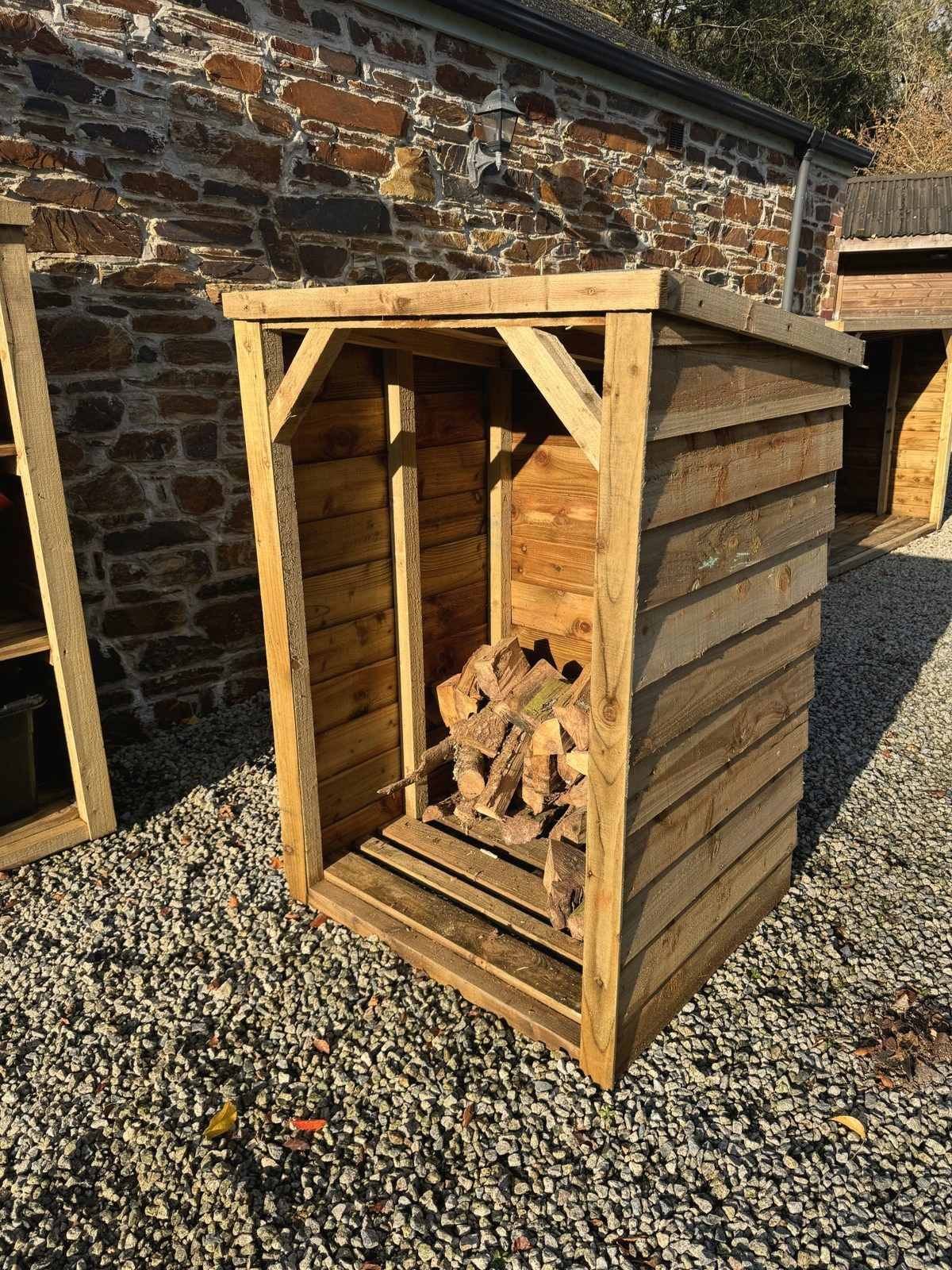 Small Featheredge Log Store in heavy tanalised timber