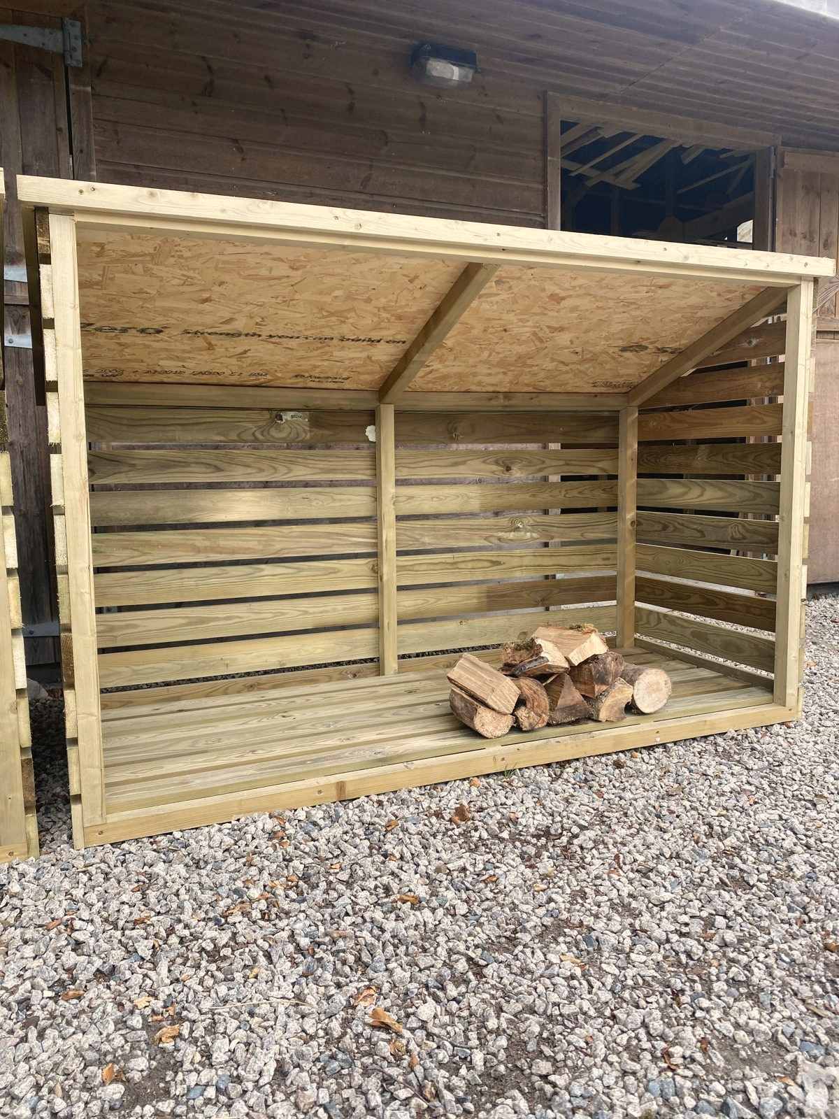 A large slatted timber log store